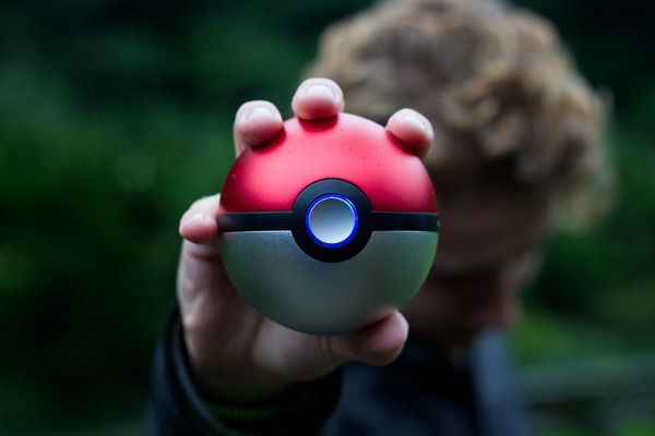 A person holding a Pokeball