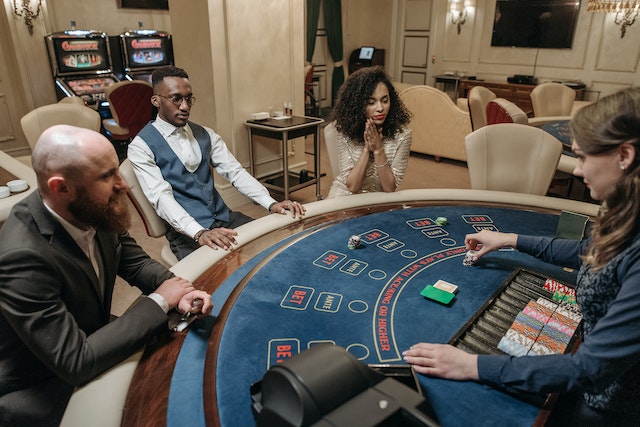 Gamblers and the Dealer in Blackjack Table