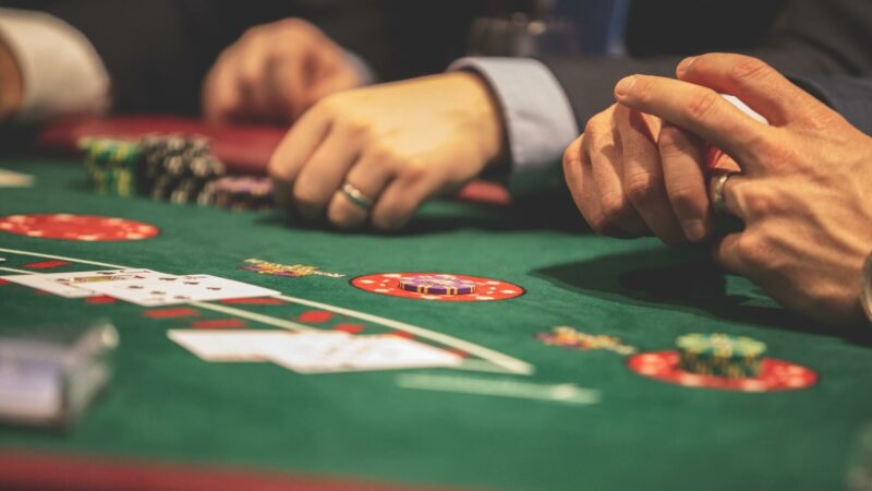 people playing blackjack at a casino
