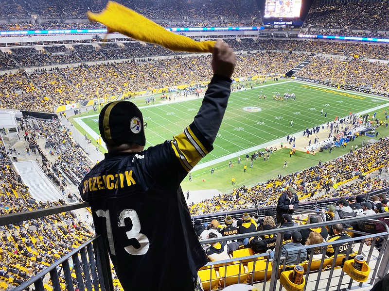 Pittsburgh Steelers Fans Waving the “Terrible Towel”