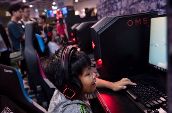 A Chinese kid playing video games.