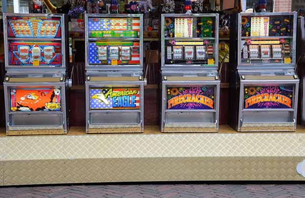 4 Single-Coin Slot Machines Lined-Up