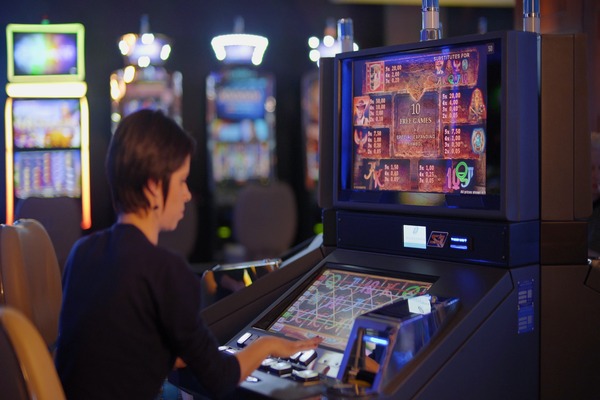 A woman playing a Touchscreen Slot Machine