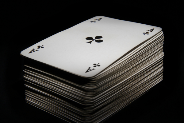 A deck of cards with ace of clubs on top