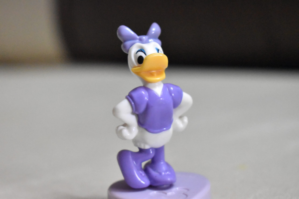 Photo shows a tiny Daisy Duck toy