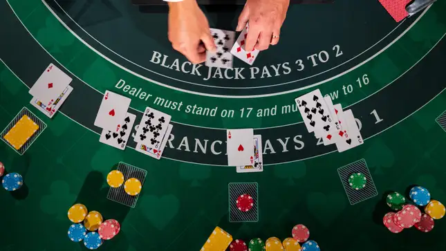 Blackjack table dealer dealing cards